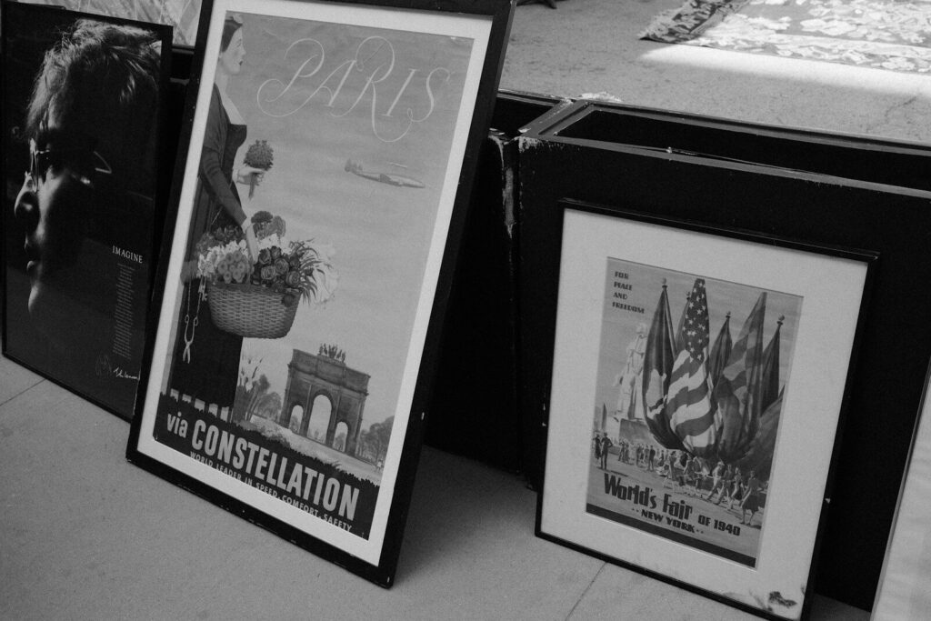 Framed vintage posters displayed in a row